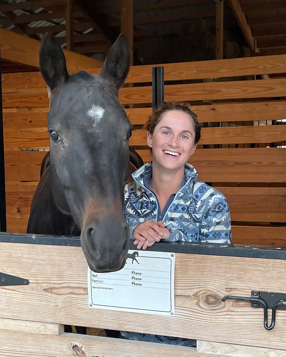 Barn Banter Episode 15 guest, Paige Billek, DVM in the stall with a horse