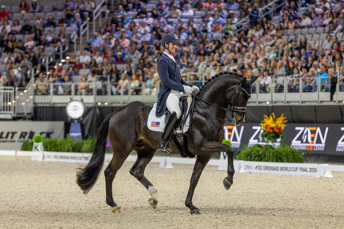 The Fort Worth FEI World Cup Final crowd's energy is reflected on the USA's Christian Simon's smiling face during his Freestyle test with Indian Rock.