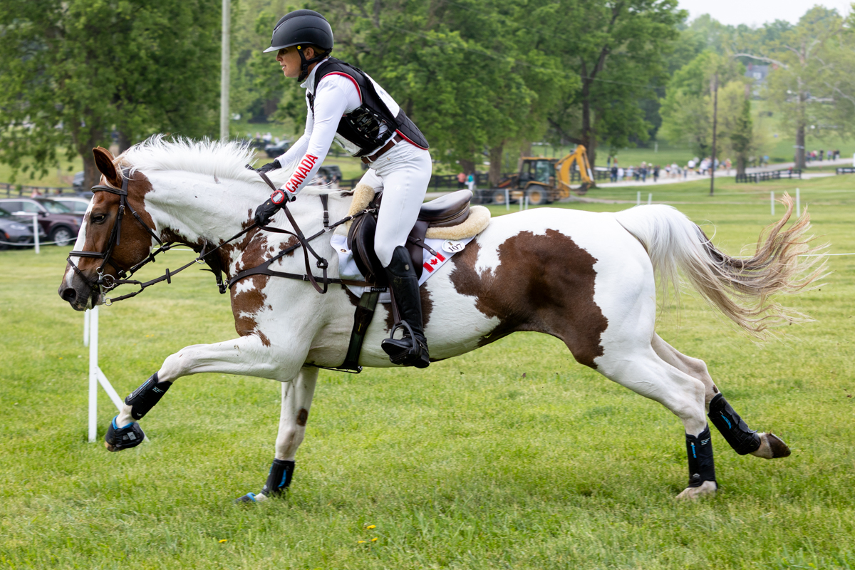 Fluorescent Adolescent and Jessica Phoeniz galloping on the cross-country course.