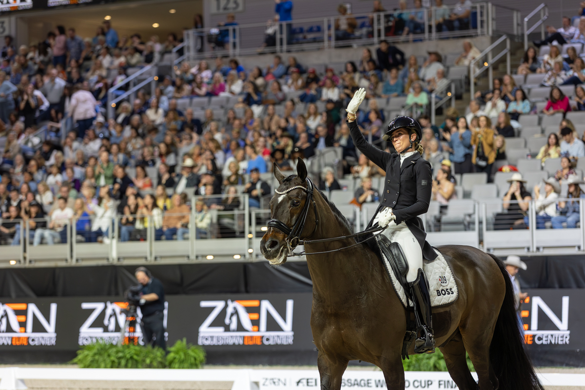 Morgan Barbançon gratefully waves to the crowd after a final ride on Sir Donnerhall II OLD, aka Gus.