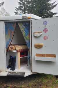 A trailer tack room converted to sleeping quarters