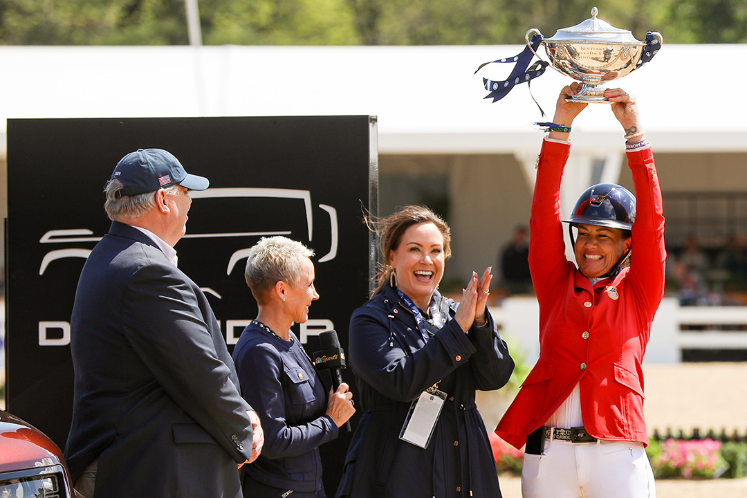 Tamie Smith holding the Land Rover Kentucky Three-Day trophy