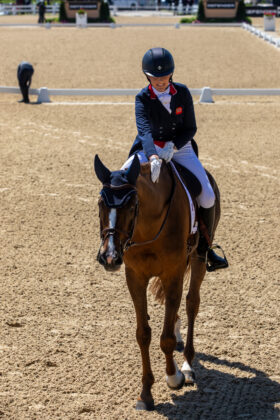 Yasmin Ingham pats Banzai du Loir after a successful round of dressage at the 2024 Defender Kentucky Three-Day Event