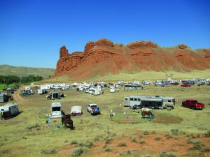 Gathering of people and horse equipment at Big Horn 100.