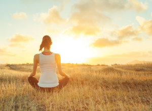 Yoga - Meditation - Woman Sitting in field