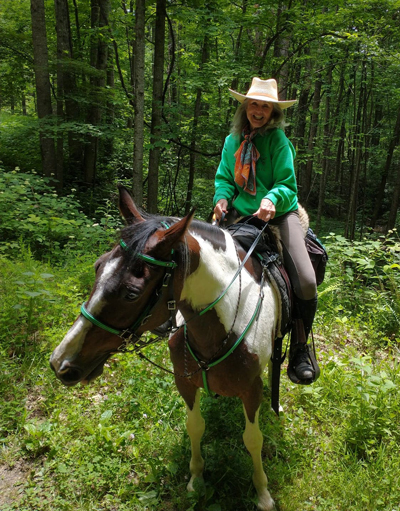 Deirdre Perot on trail horse Boomer