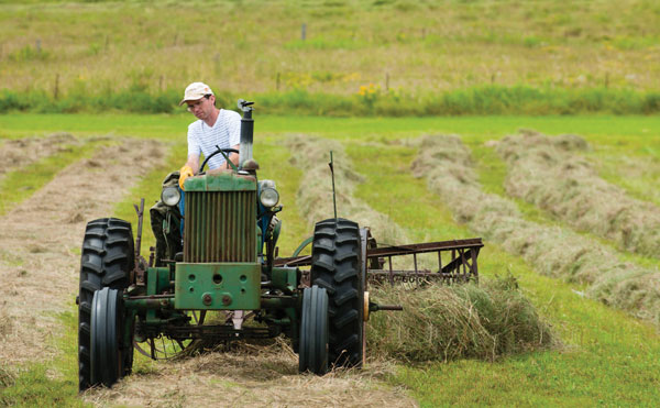 Grow your own hay - Man on tractor