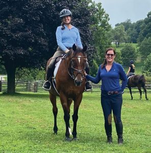 Horse and rider with trainer.