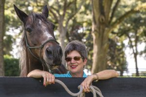 Older woman with horse.