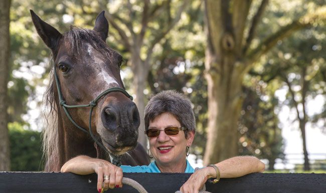 Older woman with horse.