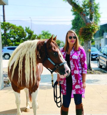 raquel lynn with her paint horse